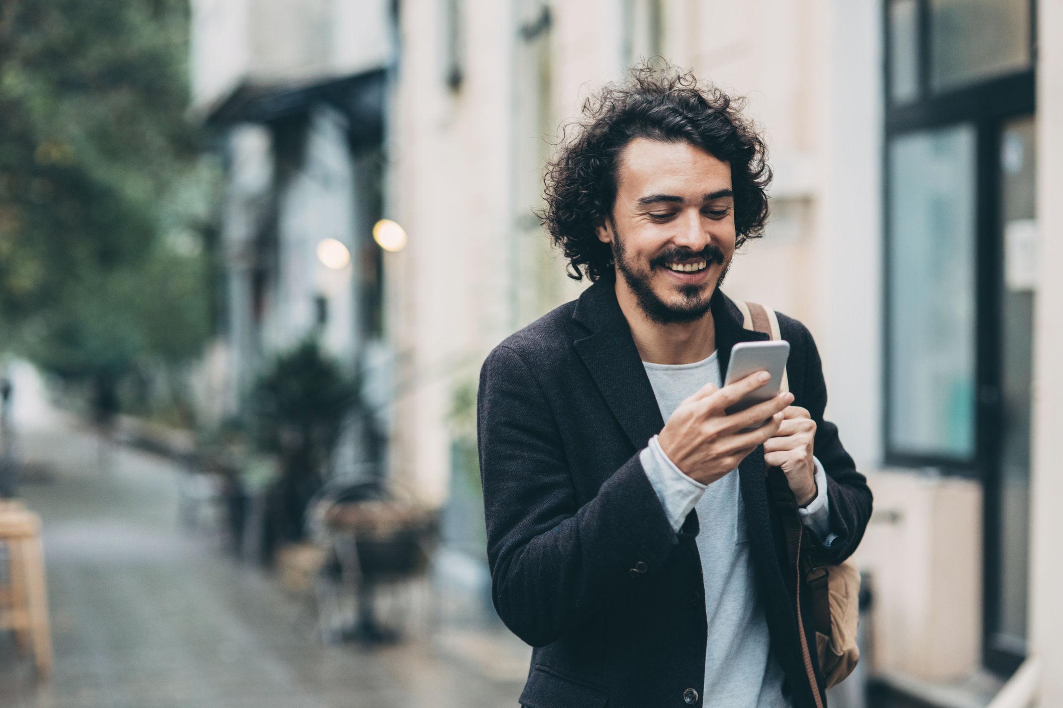 Man texting in the city