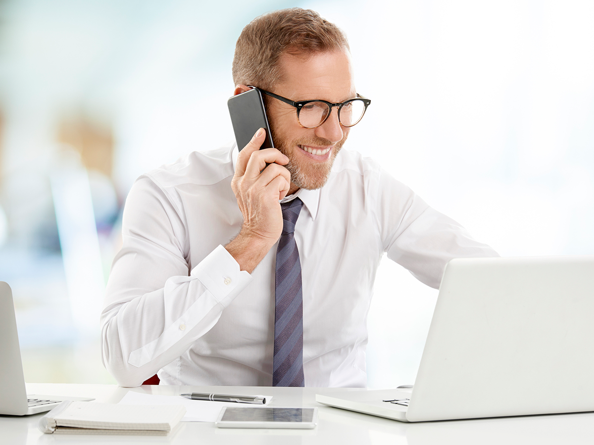 Businessman-consulting-on-mobile-phone-with-his-client-stock-photo (1)