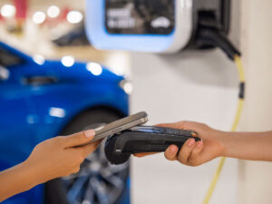A customer making a contactless payment with using their phone.